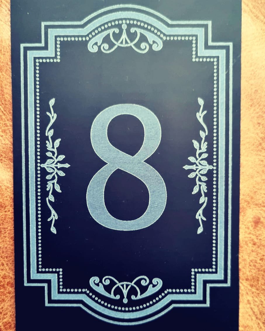 Laser engraved aluminium house number plaque with decorative border and large number 8