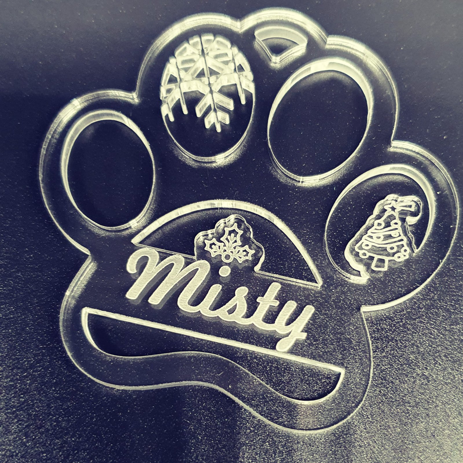 Personalised clear acrylic Christmas ornament engraved with the name Misty